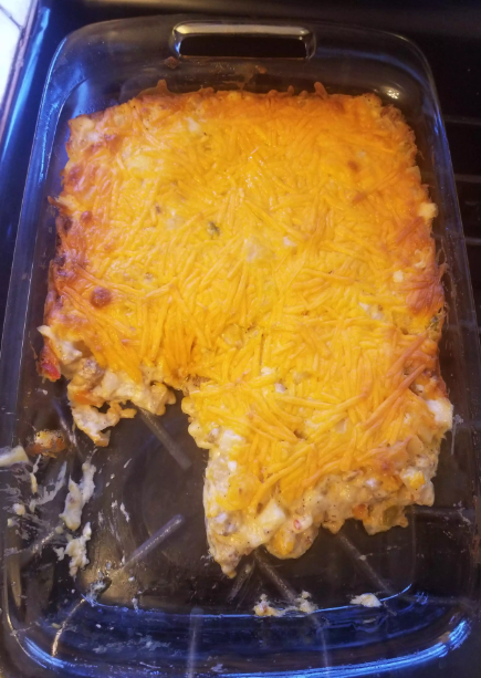 Vegan Breakfast Hash Brown Casserole with crispy potatoes, vegan sausage, and melted cheese topping