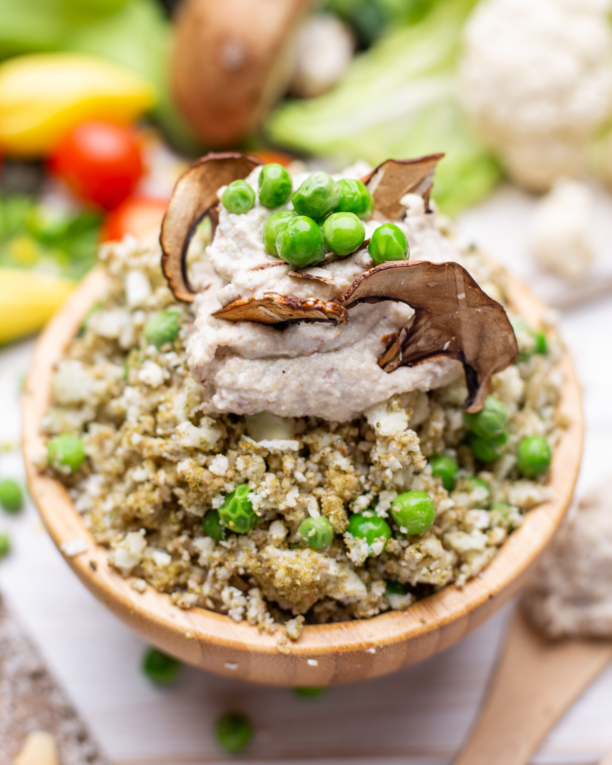 Close-up of a Vegan Gluten-Free Salad Bowl with Mushrooms, Cauliflower, Green Peas, and Creamy Plant-Based Dressing