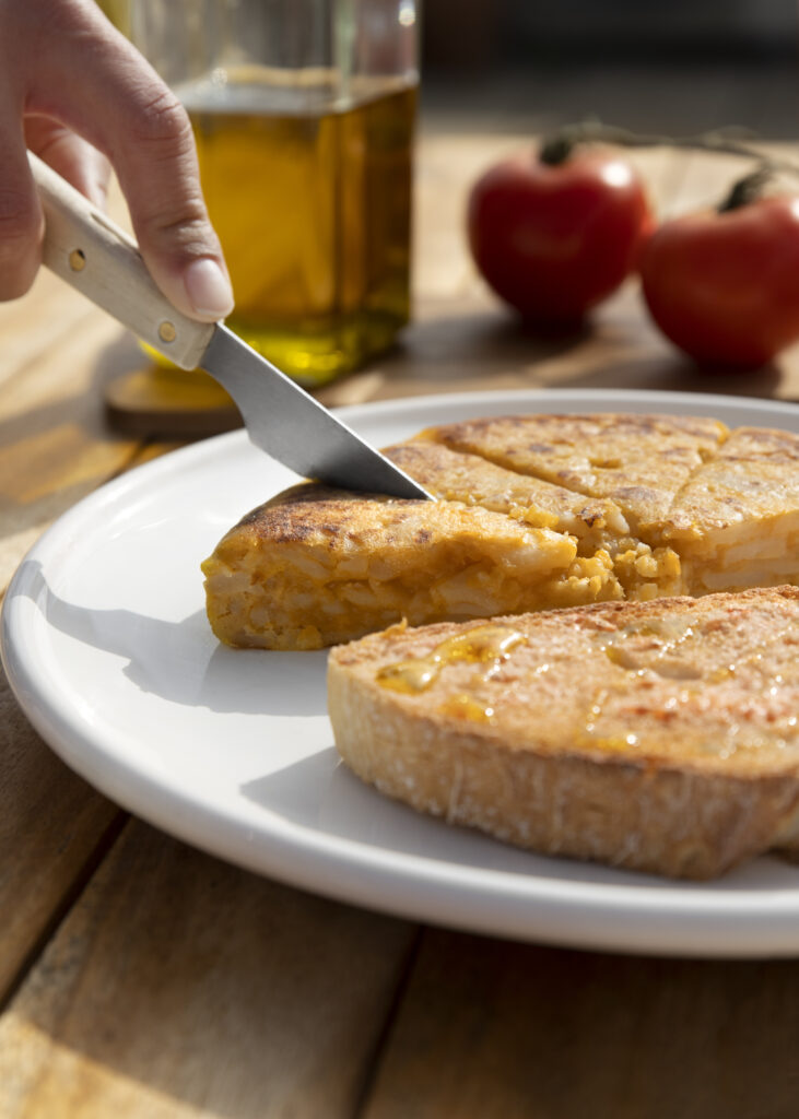 A freshly baked vegan cornbread recipe served on a wooden platter