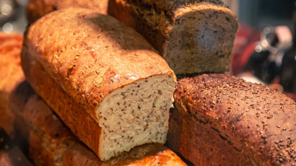 Easy vegan banana bread loaf with seeds and a golden crust